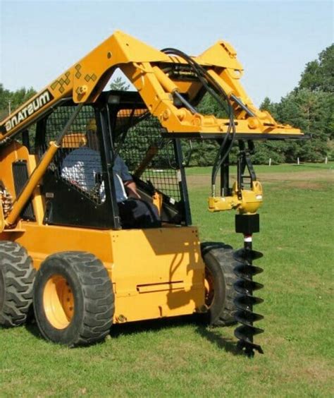 cat skid steer post hole digger|post hole digger for skid steer sale.